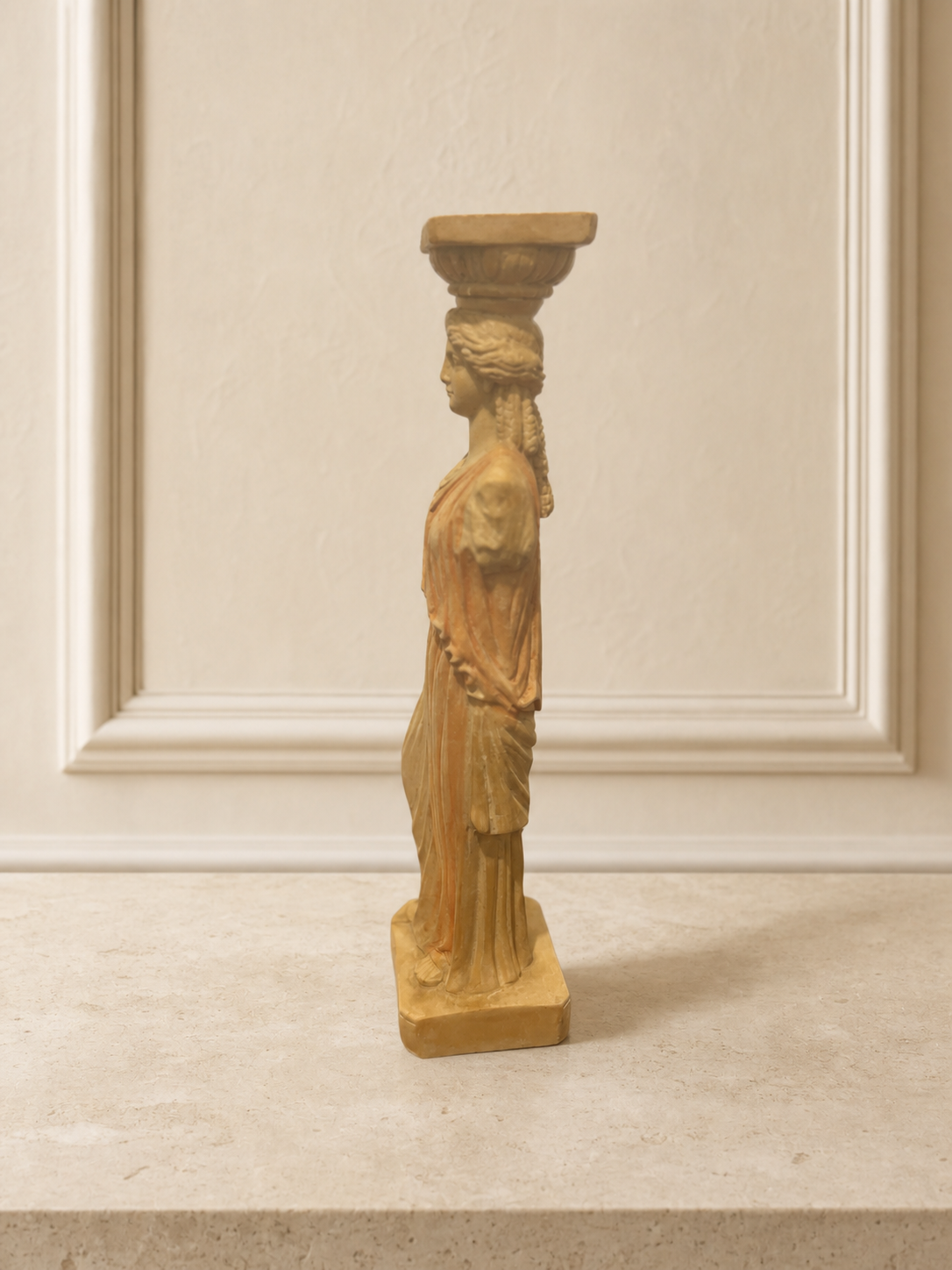 Decorative caryatid figurine in classical greek style